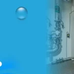 Commercial water heater system with insulated storage tanks and piping in a mechanical room for business hot water supply.