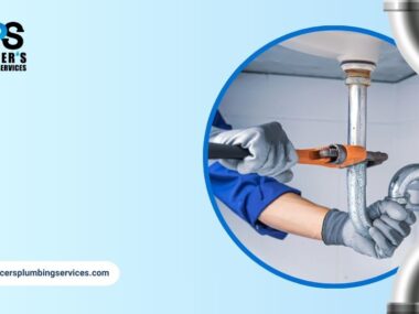Plumber repairing under-sink pipes representing reliable plumbing services in Houston homes.