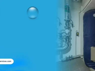 Commercial water heater system with insulated storage tanks and piping in a mechanical room for business hot water supply.